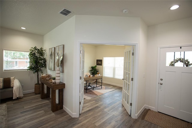 9445 Eldridge Rd, Spring Hill, FL 34608 - foyer entrance with wood finished floors, healthy amount of natural light, and recessed lighting