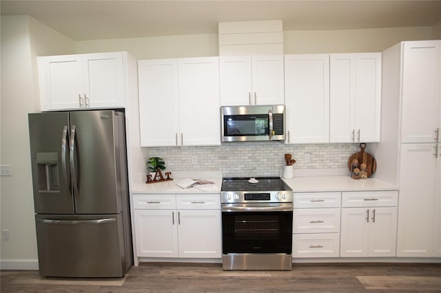 9445 Eldridge Rd, Spring Hill, FL 34608 - kitchen featuring stainless steel appliances, light countertops, and dark wood-type flooring