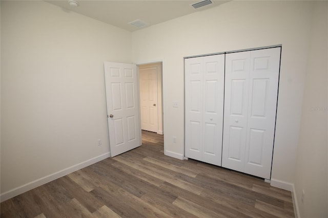 9445 Eldridge Rd, Spring Hill, FL 34608 - unfurnished bedroom featuring wood finished floors and a closet