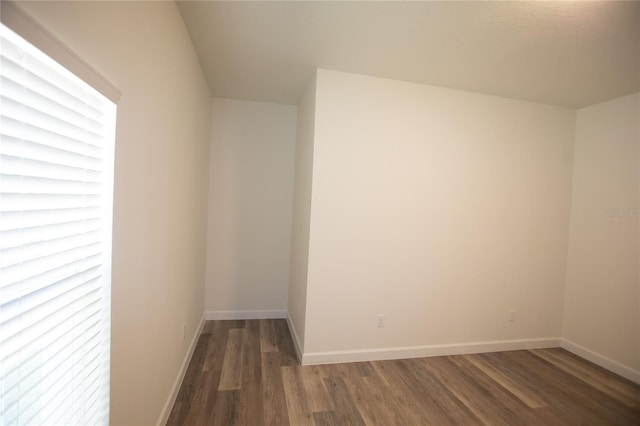 9445 Eldridge Rd, Spring Hill, FL 34608 - additional living space with wood finished floors and baseboards