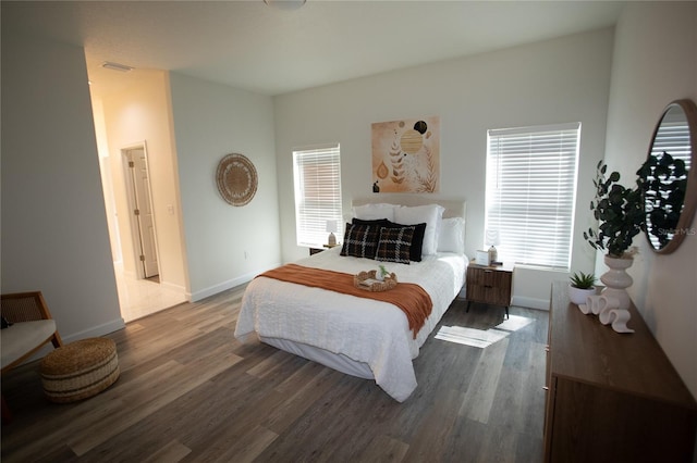 9445 Eldridge Rd, Spring Hill, FL 34608 - bedroom featuring multiple windows and wood finished floors