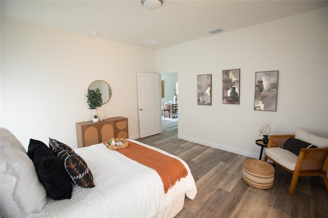 9445 Eldridge Rd, Spring Hill, FL 34608 - bedroom featuring wood finished floors and baseboards