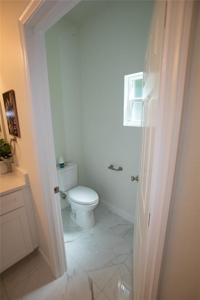 9445 Eldridge Rd, Spring Hill, FL 34608 - bathroom featuring marble finish floors and vanity