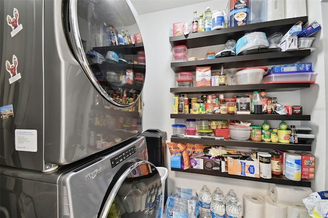 interior space with laundry area and stacked washer and clothes dryer