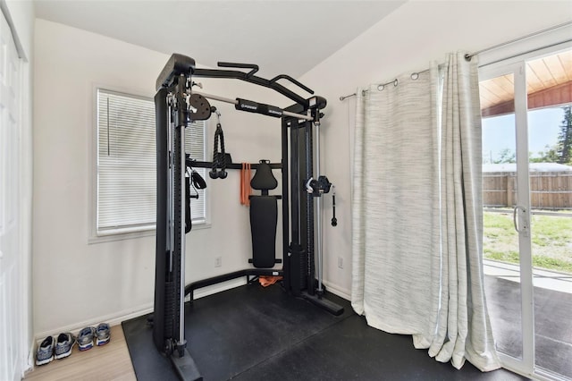 exercise area featuring baseboards and a wealth of natural light