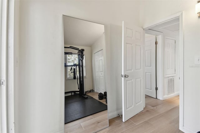 interior space featuring visible vents and wood tiled floor