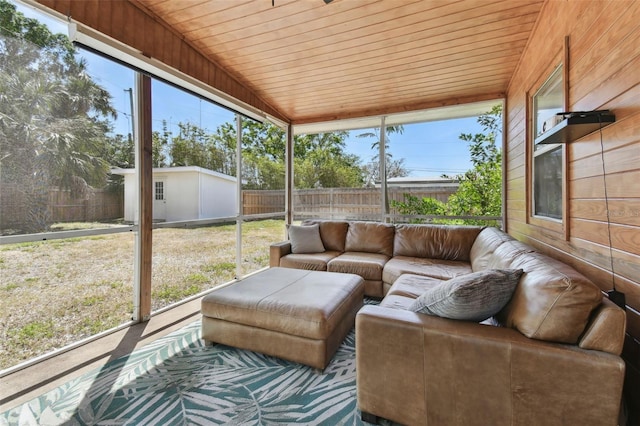 sunroom with plenty of natural light and wooden ceiling