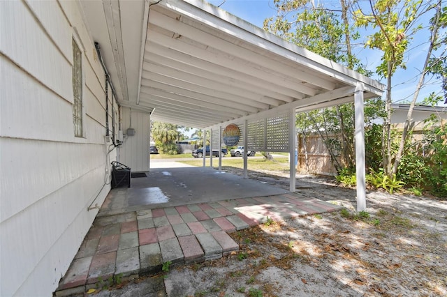 view of patio featuring fence