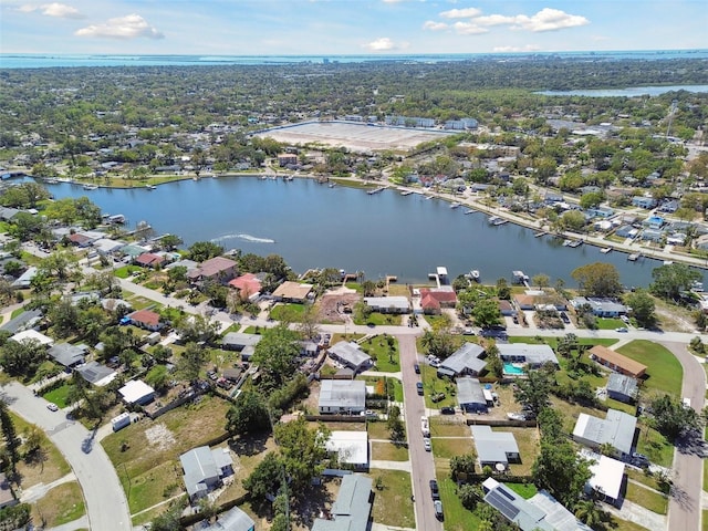 birds eye view of property with a water view and a residential view