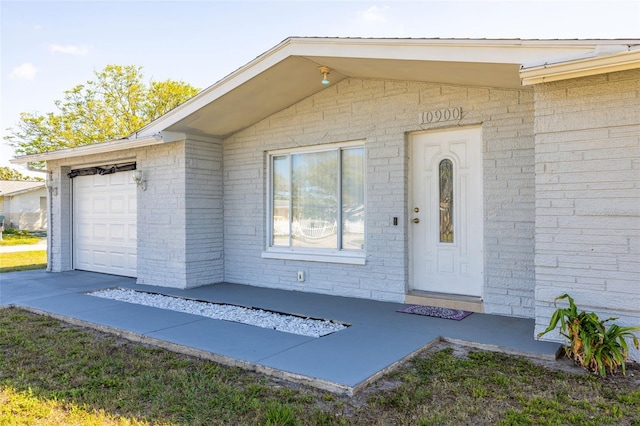 property entrance with an attached garage