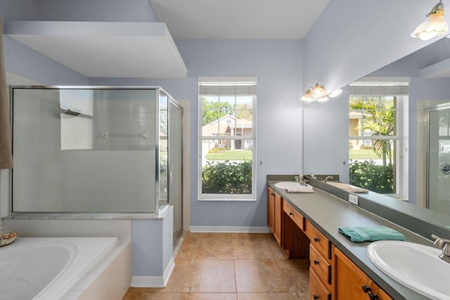 5123 Whispering Leaf Trl, Valrico, FL 33596 - full bath with double vanity, a stall shower, a sink, a bath, and baseboards