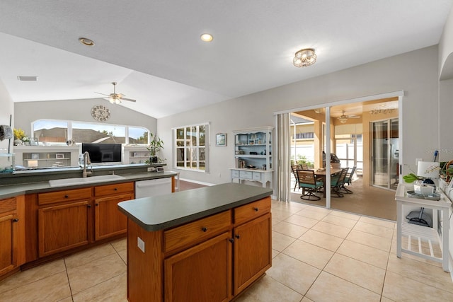 5123 Whispering Leaf Trl, Valrico, FL 33596 - kitchen with dark countertops, ceiling fan, a sink, and vaulted ceiling