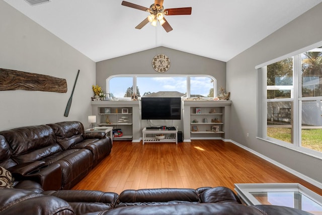 5123 Whispering Leaf Trl, Valrico, FL 33596 - living room with plenty of natural light, lofted ceiling, ceiling fan, and hardwood / wood-style flooring