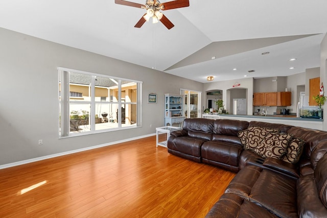 5123 Whispering Leaf Trl, Valrico, FL 33596 - living area with lofted ceiling, recessed lighting, ceiling fan, baseboards, and light wood-style floors