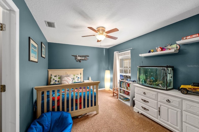 5123 Whispering Leaf Trl, Valrico, FL 33596 - bedroom with a ceiling fan, a textured ceiling, light carpet, and visible vents