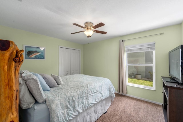 5123 Whispering Leaf Trl, Valrico, FL 33596 - carpeted bedroom with multiple windows, a closet, baseboards, and ceiling fan