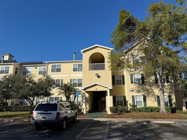 18575 Bridle Club Dr Unit 18575, Tampa, FL 33647 - view of building exterior with uncovered parking