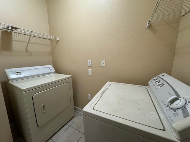 18575 Bridle Club Dr Unit 18575, Tampa, FL 33647 - clothes washing area with laundry area, light tile patterned floors, and washer and clothes dryer