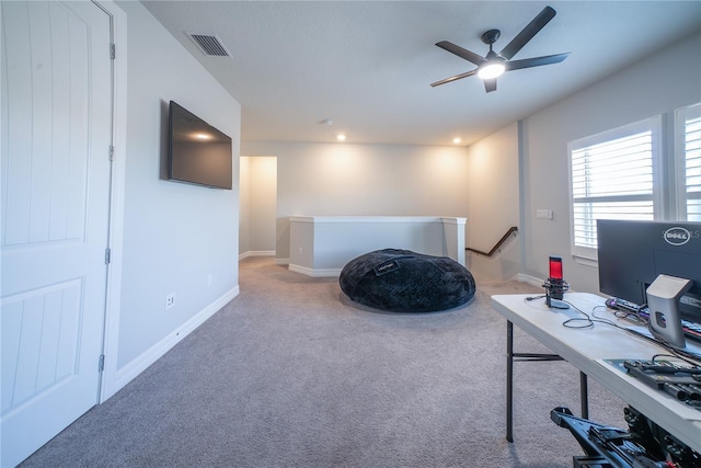 carpeted office space featuring recessed lighting, a ceiling fan, visible vents, and baseboards