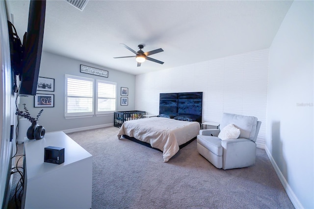 bedroom with visible vents, baseboards, a ceiling fan, and carpet flooring