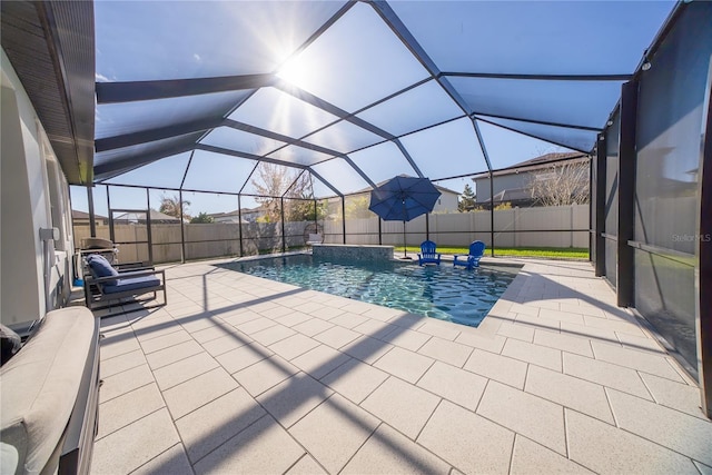 view of pool featuring a fenced in pool, a patio, a fenced backyard, and glass enclosure