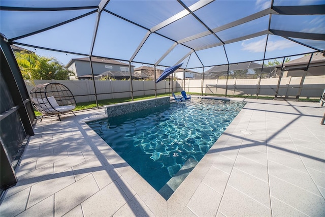 view of pool with a patio area, a fenced in pool, a lanai, and a fenced backyard