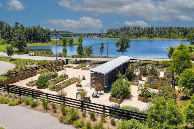 birds eye view of property with a water view