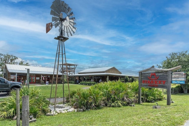 view of home's community featuring a lawn