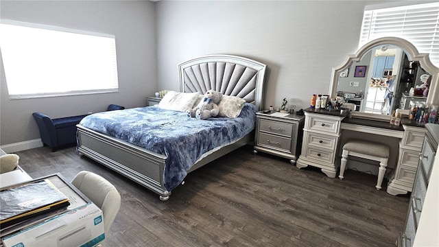 bedroom with dark wood-style floors