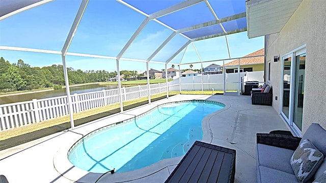 25631 Bruford Blvd, Land O Lakes, FL 34639 - view of swimming pool featuring a fenced backyard, a water view, a patio, and glass enclosure