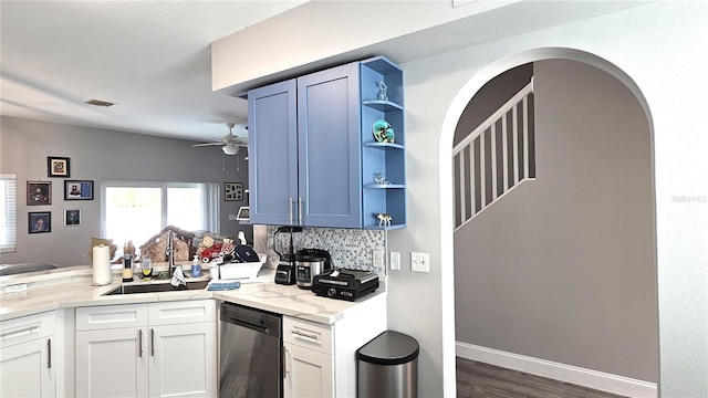 25631 Bruford Blvd, Land O Lakes, FL 34639 - kitchen featuring stainless steel dishwasher, a peninsula, a sink, open shelves, and dark wood-style floors