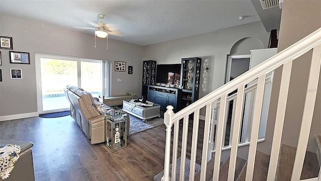 25631 Bruford Blvd, Land O Lakes, FL 34639 - living area with a ceiling fan, wood finished floors, stairs, and baseboards