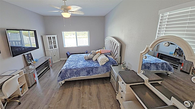 25631 Bruford Blvd, Land O Lakes, FL 34639 - bedroom with wood finished floors, a ceiling fan, and baseboards