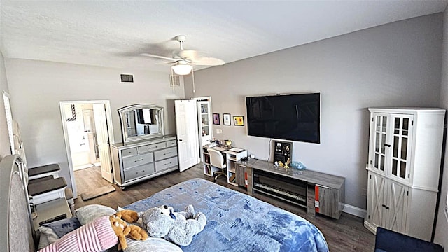 25631 Bruford Blvd, Land O Lakes, FL 34639 - bedroom featuring dark wood finished floors, baseboards, ceiling fan, and ensuite bathroom