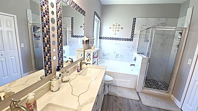 25631 Bruford Blvd, Land O Lakes, FL 34639 - full bathroom with a garden tub, a shower stall, vanity, wood finished floors, and toilet