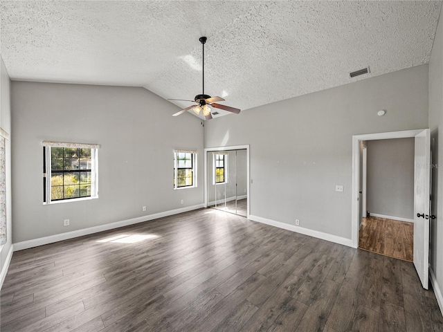 unfurnished room featuring visible vents, dark wood-type flooring, baseboards, ceiling fan, and a textured ceiling