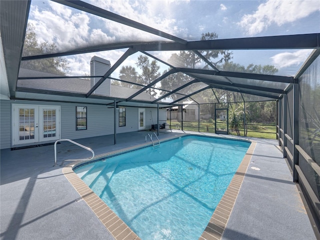 pool featuring a lanai, french doors, and a patio