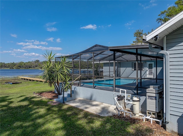 exterior space featuring an outdoor pool, a water view, and a lanai