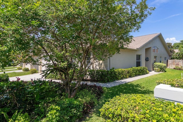 2991 Covewood Pl, Clearwater, FL 33761 - view of front facade featuring stucco siding and a shingled roof