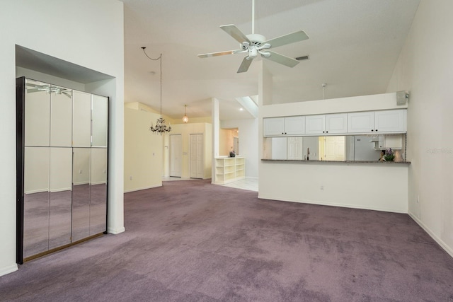 2991 Covewood Pl, Clearwater, FL 33761 - unfurnished living room featuring a ceiling fan, high vaulted ceiling, carpet floors, and baseboards