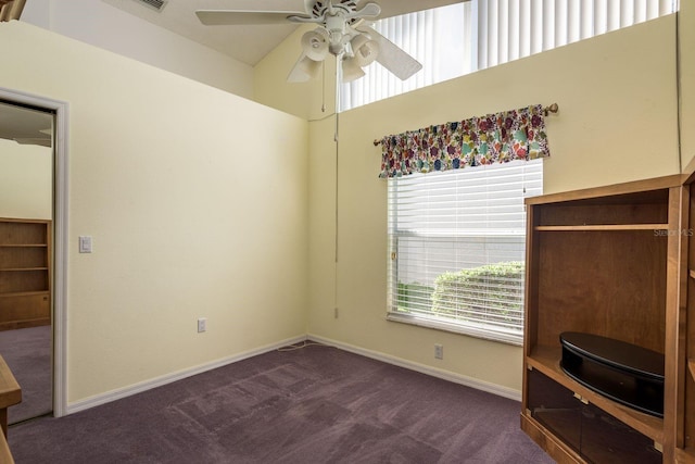 2991 Covewood Pl, Clearwater, FL 33761 - unfurnished bedroom with multiple windows, dark carpet, baseboards, and a ceiling fan