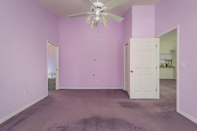 2991 Covewood Pl, Clearwater, FL 33761 - unfurnished bedroom featuring carpet, baseboards, ceiling fan, and a high ceiling