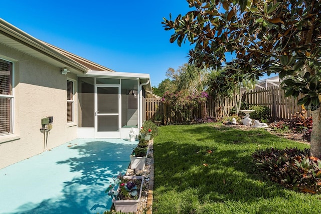2991 Covewood Pl, Clearwater, FL 33761 - view of yard featuring a sunroom and a patio