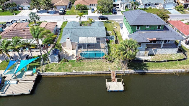 aerial view featuring a residential view and a water view