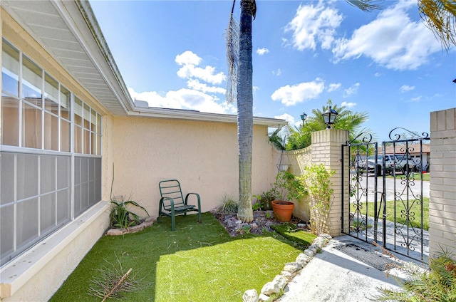 view of yard with a gate