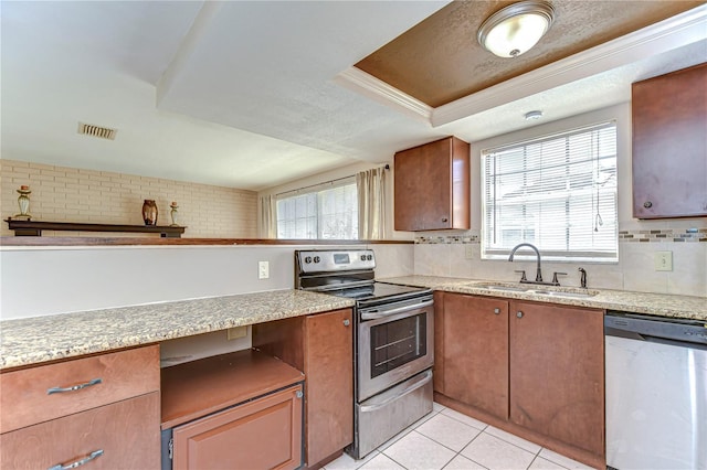 kitchen featuring a sink, stainless steel appliances, plenty of natural light, and visible vents