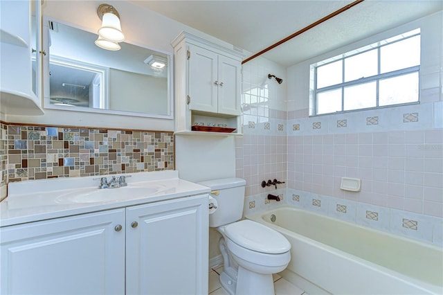 bathroom with backsplash, vanity, toilet, and shower / bathtub combination