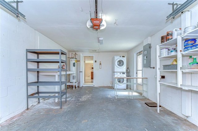 garage with concrete block wall, electric panel, water heater, stacked washer / dryer, and a garage door opener