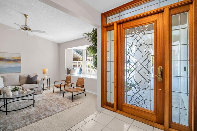 2462 Indian Trl E, Palm Harbor, FL 34683 - entryway featuring carpet flooring, a ceiling fan, baseboards, and a textured ceiling