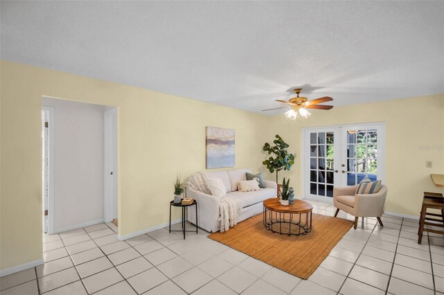 2462 Indian Trl E, Palm Harbor, FL 34683 - living room featuring french doors, ceiling fan, baseboards, and light tile patterned floors